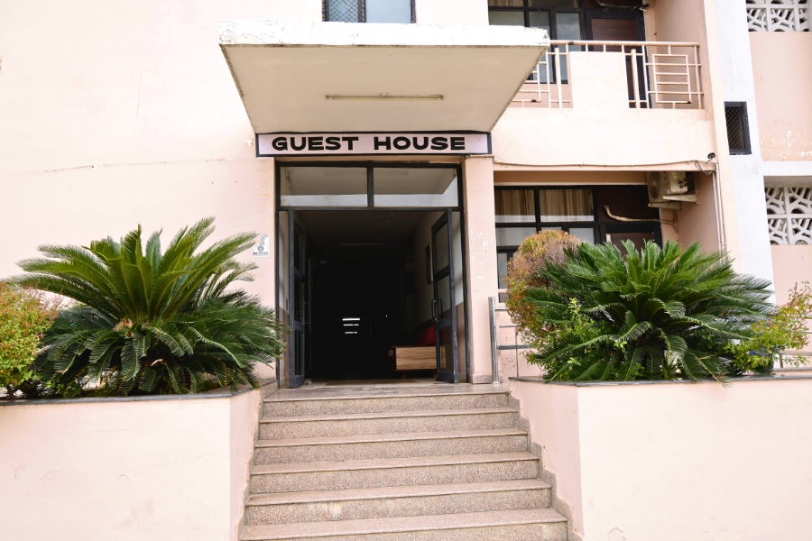 Lush Green Exterior of TMU Guest House