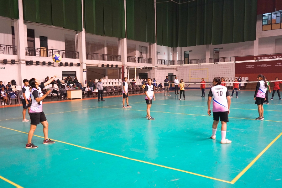 TMU students playing volleyball in the indoor sports complex